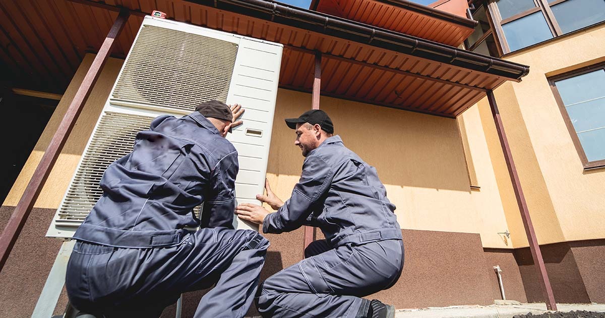 Hvac Technicians Servicing Home Heating And Cooling System on South Shore of Massachusetts